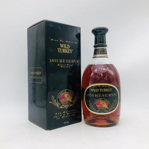ワイルドターキー1855リザーブ750ml。濃厚なキャラメルとオーク香が特徴のプレミアムバーボンで、深い琥珀色と重厚な味わいの限定ボトル。112.2°(56.1%)